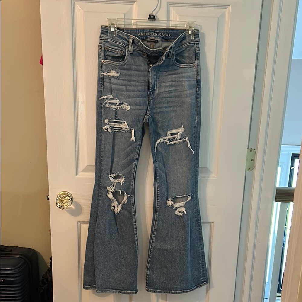 American Eagle Outfitters Blue Flare stretch Jeans with Distressed Details.